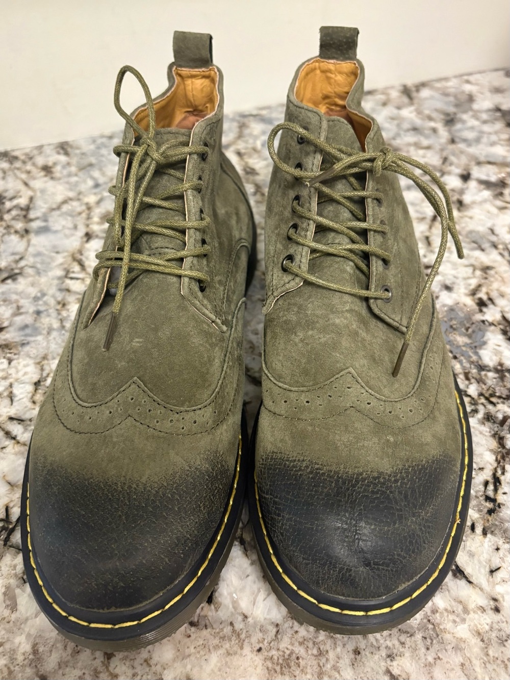 Mew Men’s olive green suede wingtip lace-up ankle boots.